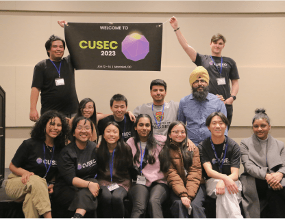 CUSEC 2023 team holding up banner